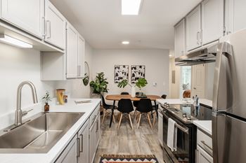 Galley kitchen with dining area and modern finishes